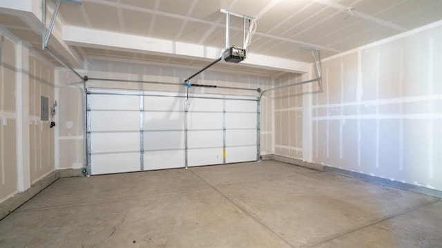 garage with electric panel and a garage door opener