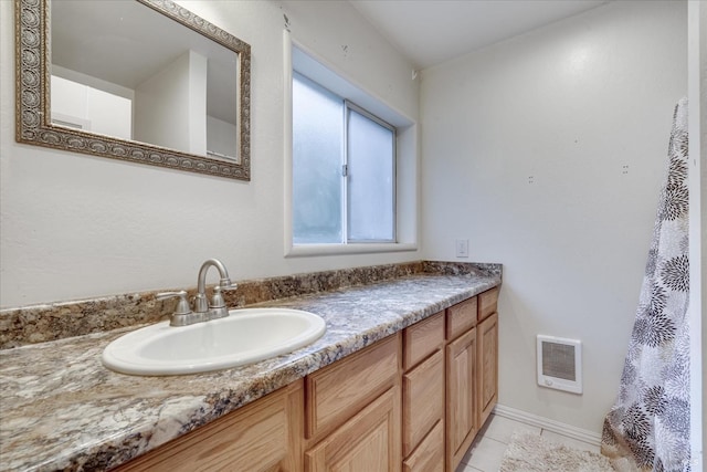 bathroom with tile patterned floors and vanity