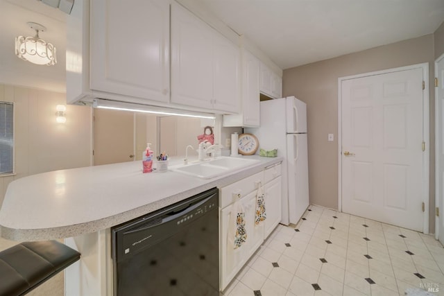 kitchen with white cabinetry, kitchen peninsula, black dishwasher, a kitchen breakfast bar, and sink