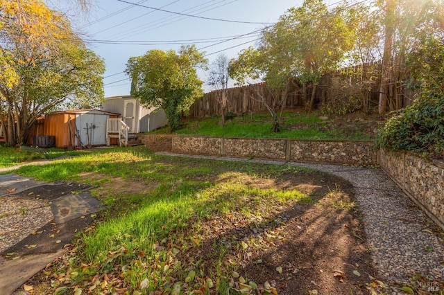 view of yard featuring a shed and cooling unit