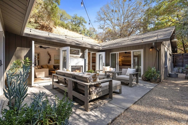 view of patio / terrace featuring an outdoor living space with a fireplace