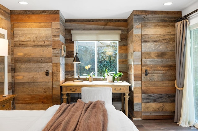 bedroom with wood walls