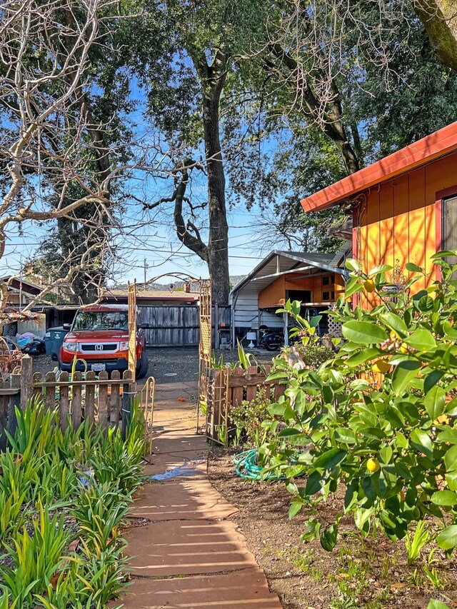 exterior space with fence and an outdoor structure