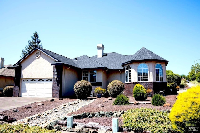 single story home featuring a garage