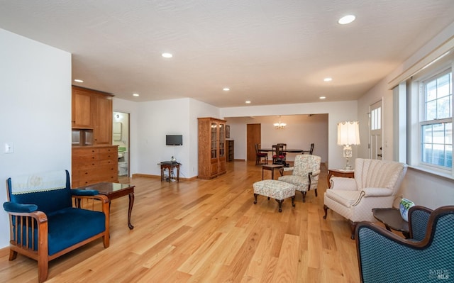 sitting room with light hardwood / wood-style flooring