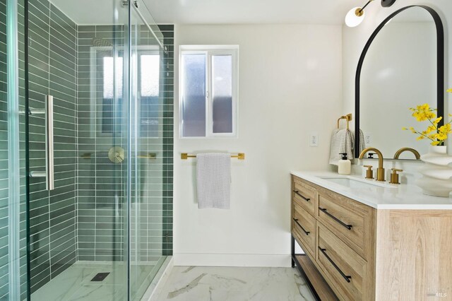 bathroom with an enclosed shower and vanity