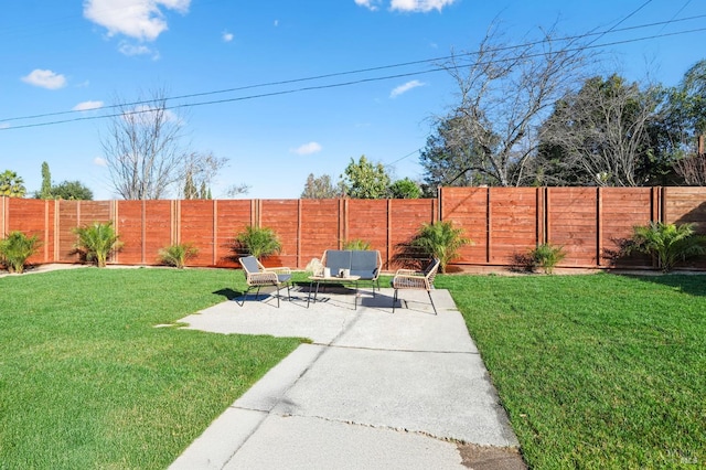 view of yard featuring a patio area and a fenced backyard