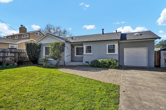 ranch-style house featuring fence, concrete driveway, an attached garage, and a front lawn