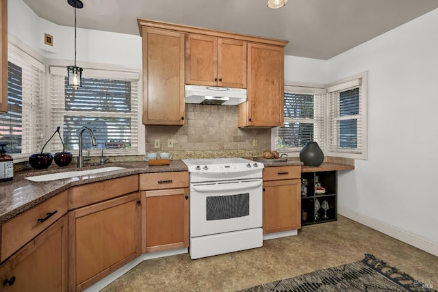 kitchen with tasteful backsplash, decorative light fixtures, electric range, under cabinet range hood, and a sink