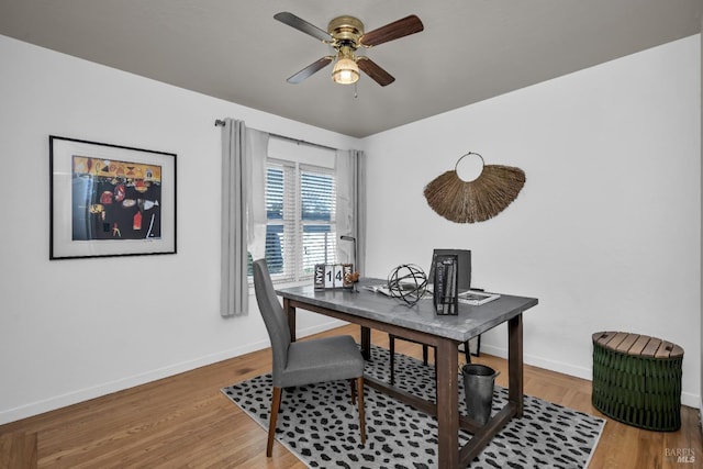 home office with baseboards, wood finished floors, and ceiling fan