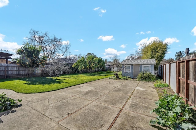 view of patio / terrace featuring an outdoor structure and a fenced backyard