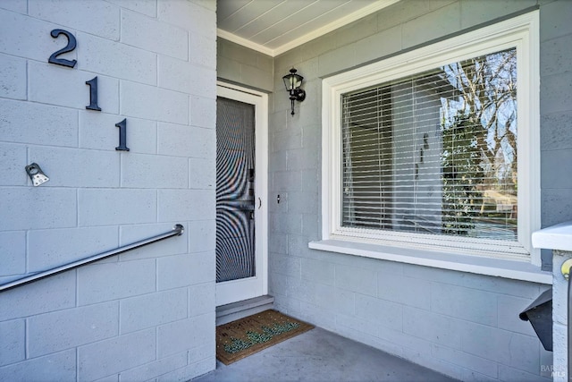 entrance to property with concrete block siding