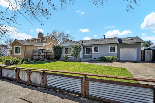 view of front of property with stucco siding, fence, a garage, a front lawn, and concrete driveway