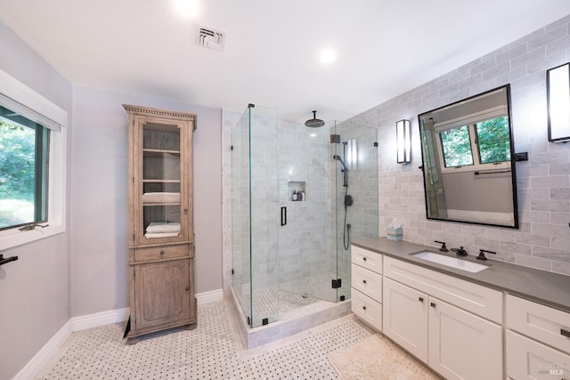 bathroom with walk in shower and vanity