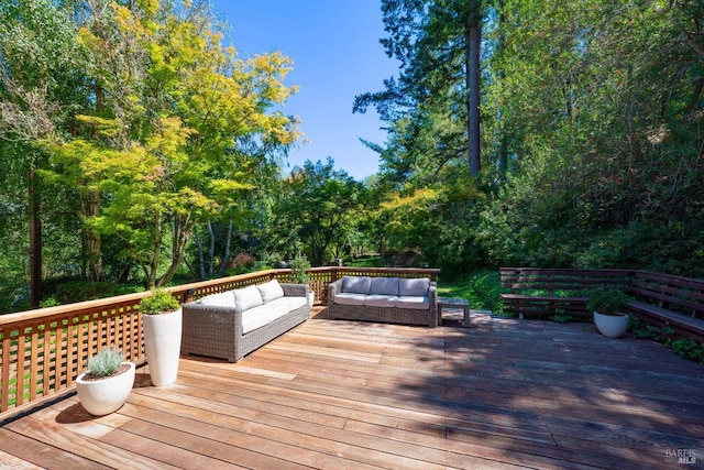 wooden terrace with outdoor lounge area