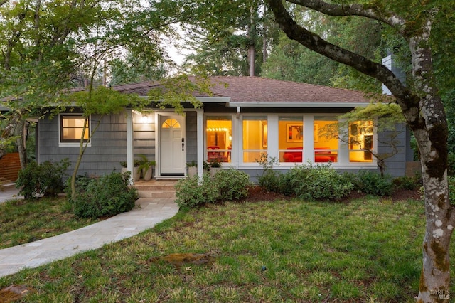 ranch-style house with a front yard