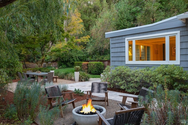 view of patio / terrace with a fire pit