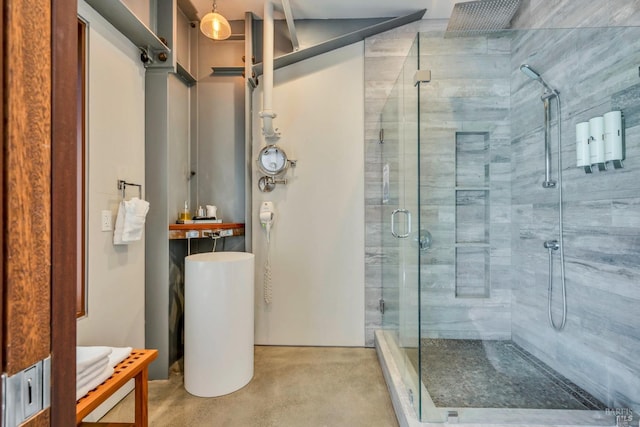 full bathroom featuring a stall shower and concrete floors