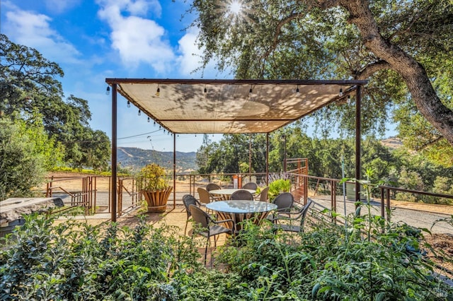 view of patio / terrace featuring a mountain view