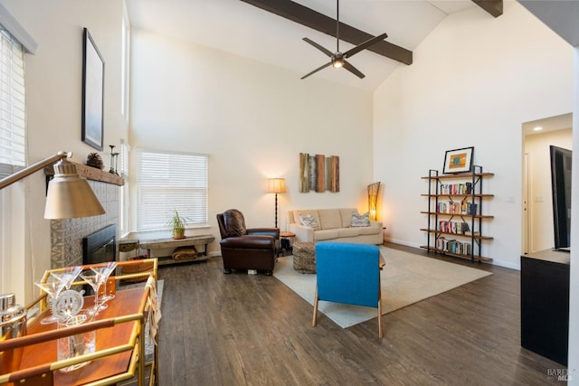 living room with dark wood-type flooring, a brick fireplace, high vaulted ceiling, and beamed ceiling