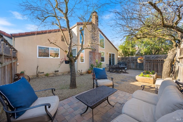 back of house with a patio area