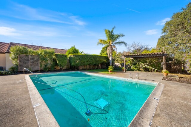 view of pool featuring a patio area and a pergola