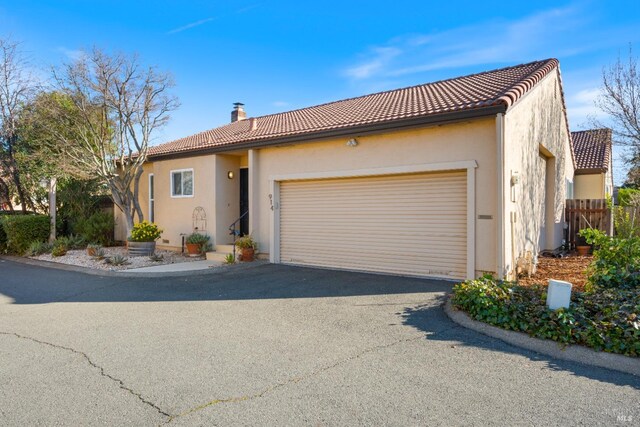 mediterranean / spanish house with a garage