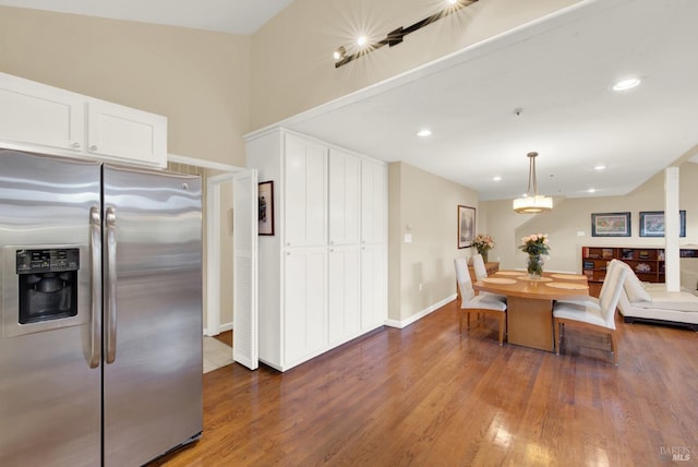 dining area with hardwood / wood-style floors