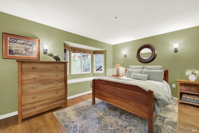 bedroom with light hardwood / wood-style flooring