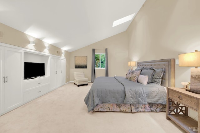 bedroom with carpet and vaulted ceiling with skylight