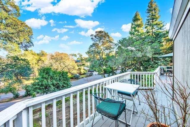 wooden balcony featuring a deck