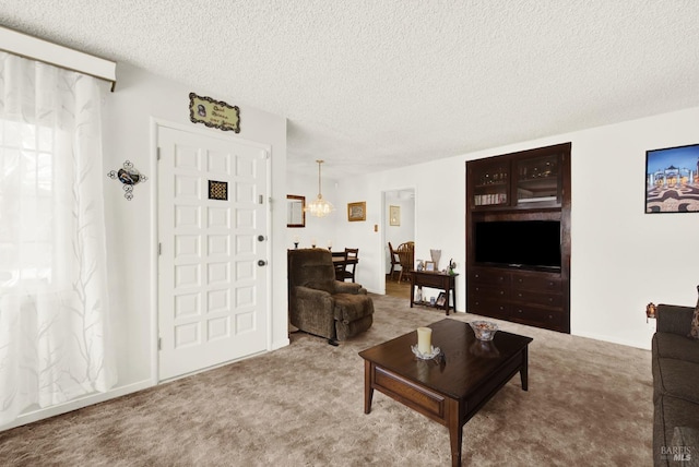 living room featuring a textured ceiling and carpet flooring