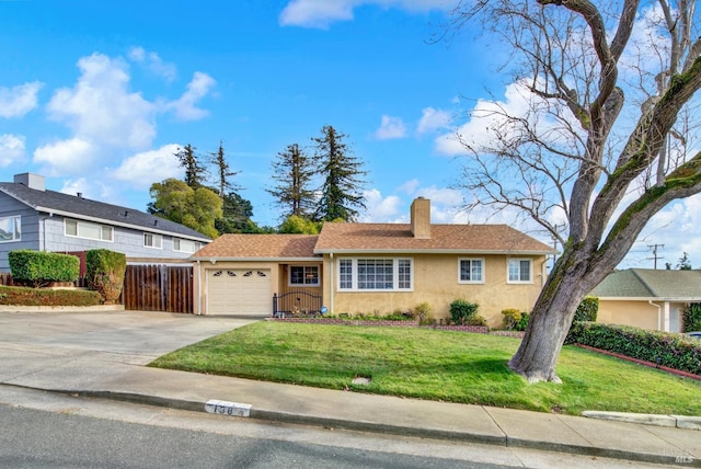 single story home featuring a garage, driveway, a front yard, and stucco siding