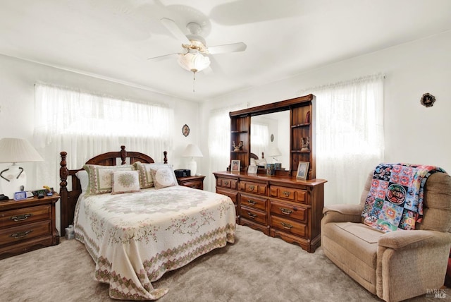 carpeted bedroom with a ceiling fan