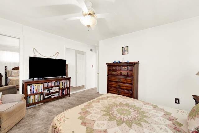 bedroom with a ceiling fan, light colored carpet, and visible vents