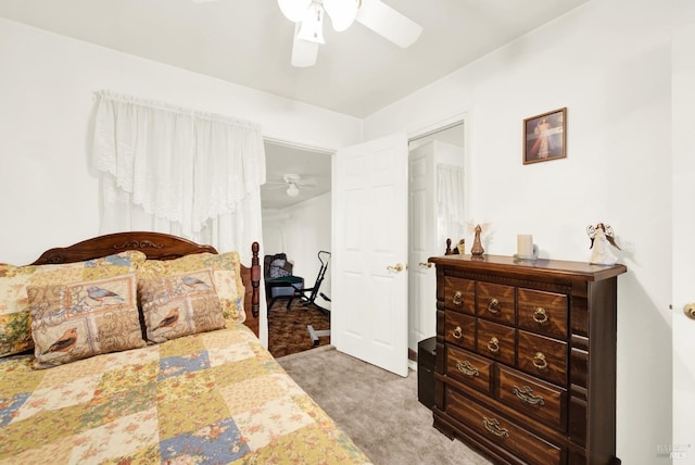 bedroom featuring a ceiling fan and light colored carpet