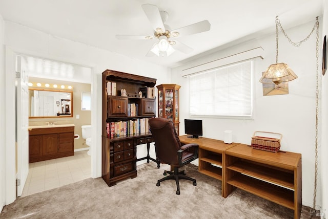 office space with ceiling fan and light colored carpet