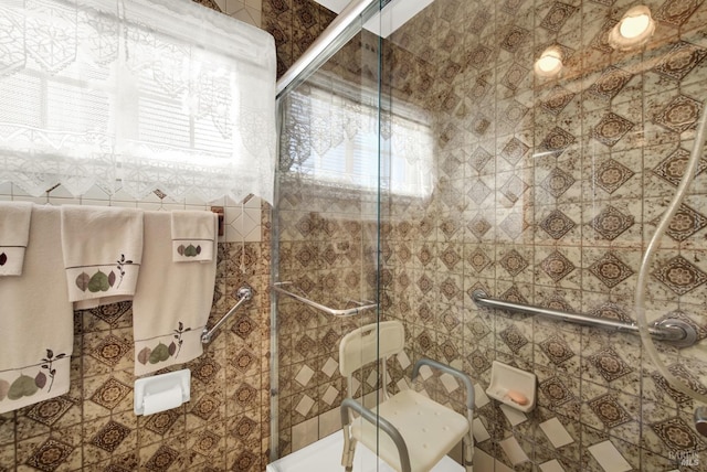 full bathroom with tiled shower