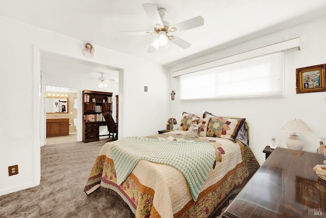 bedroom with light carpet, a ceiling fan, and ensuite bathroom