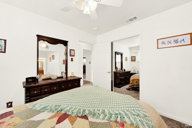 bedroom featuring light carpet, visible vents, and a ceiling fan