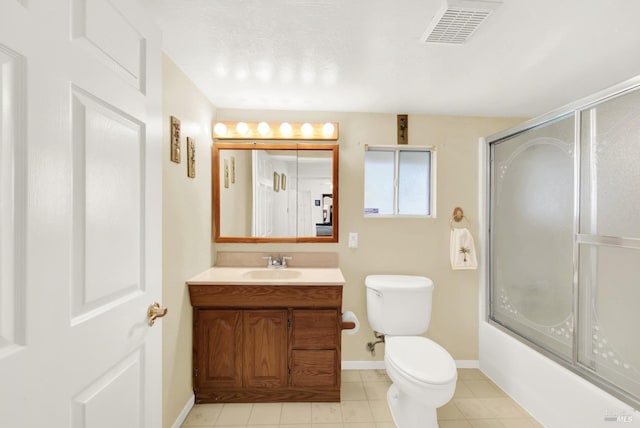 full bathroom featuring baseboards, visible vents, toilet, shower / bath combination with glass door, and vanity