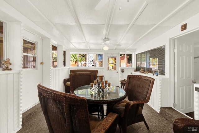 sunroom featuring a paneled ceiling and ceiling fan