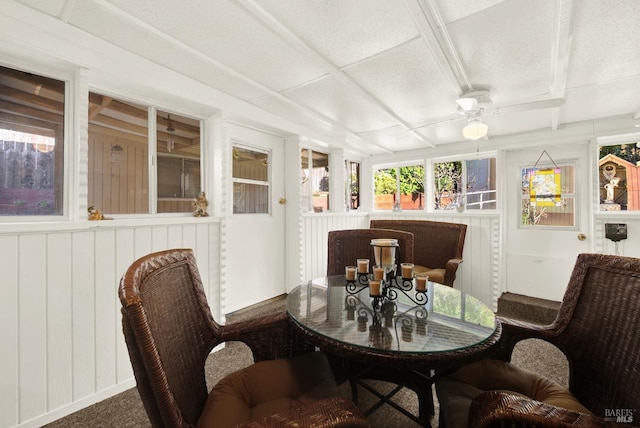 sunroom with a ceiling fan