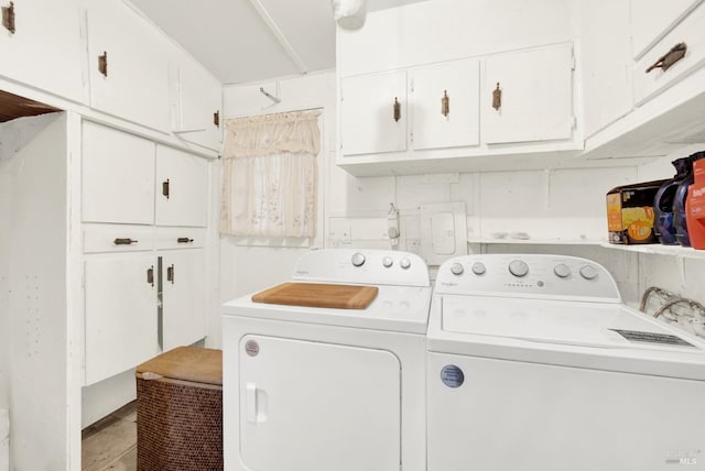 laundry room featuring cabinet space and washing machine and clothes dryer