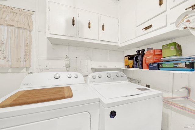 laundry room featuring cabinet space and separate washer and dryer