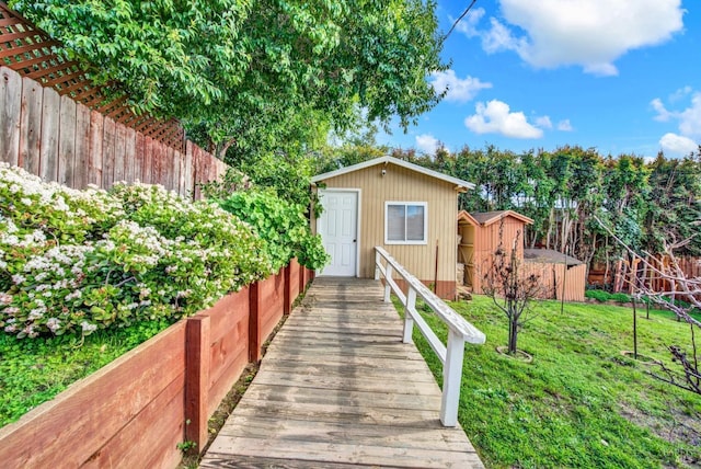 view of shed with fence