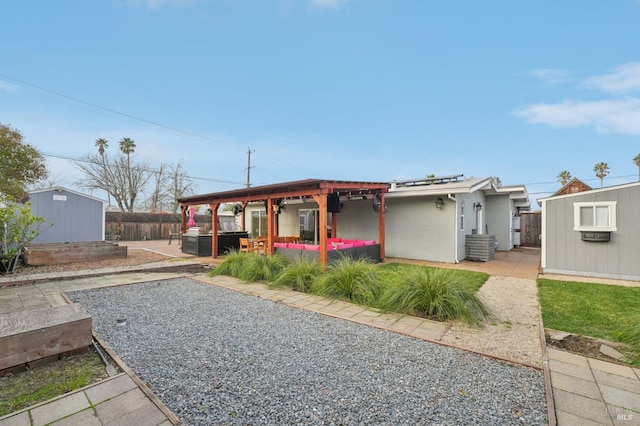 view of front of home featuring an outdoor living space, a shed, solar panels, and a patio