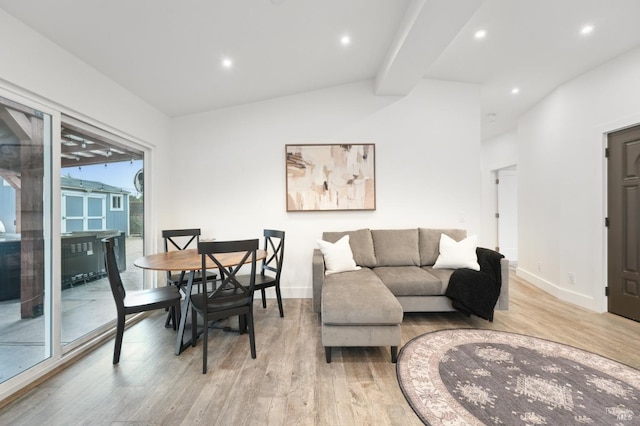 living room featuring lofted ceiling and light wood-type flooring