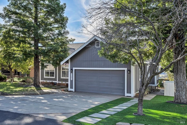 view of front of house featuring a front yard and a garage