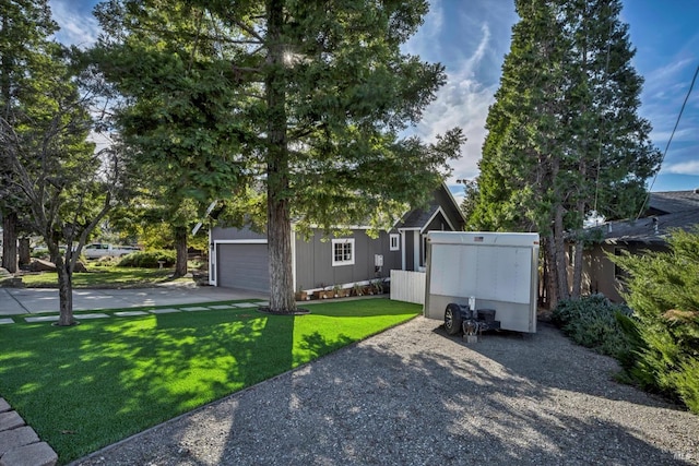 view of front of property with a garage and a front yard